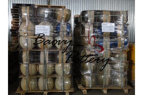 Goods loaded on pallet, covered by plastic film and fastened by strings